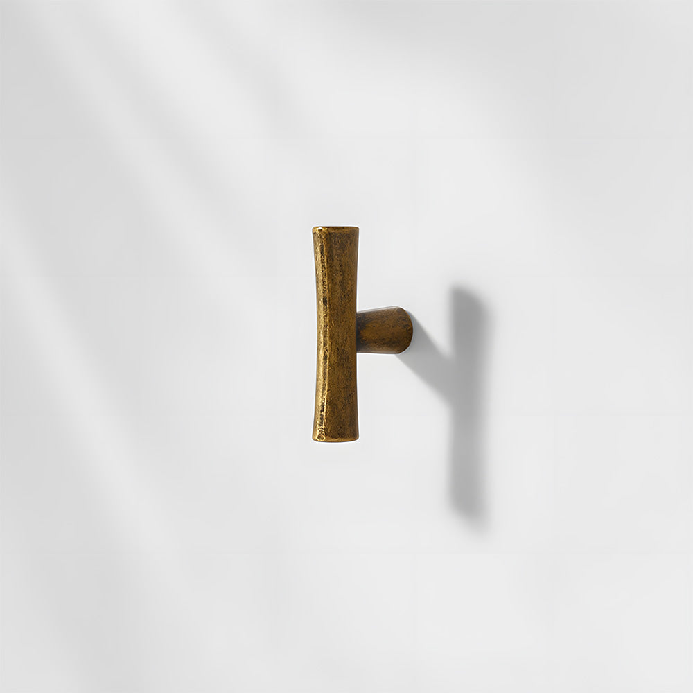 Antique bronze tapered bar cabinet pull and knobs, shown at close range on a clean neutral background