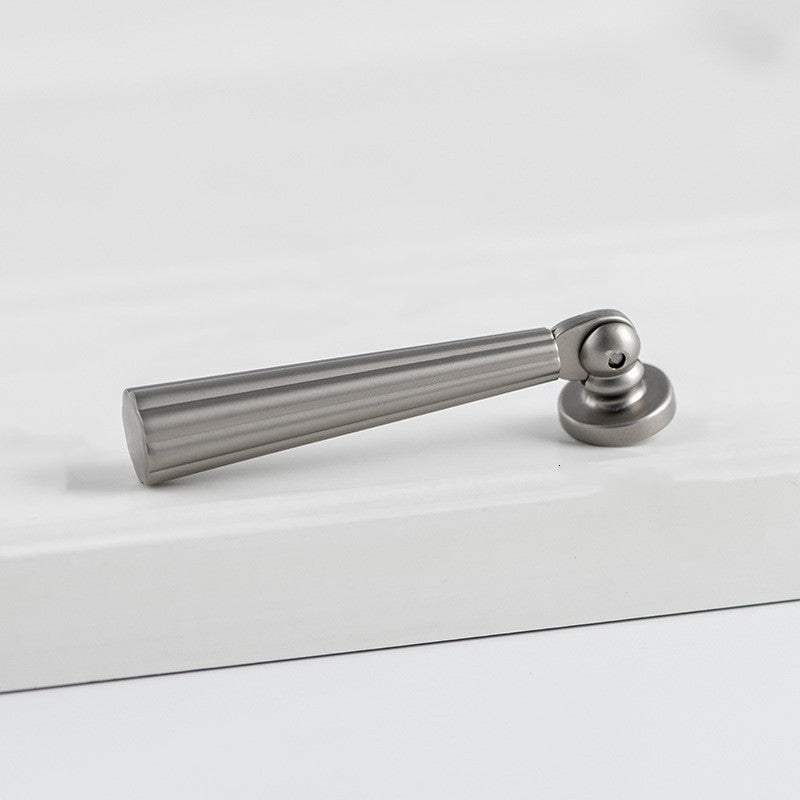 Brushed nickel fluted pendant drop pull, shown from one angle with its construction and finish visible
