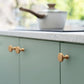Gold Arched Cabinet Handles and Round Knobs