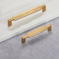 Ribbed Brass Cabinet Handles and Matching Knobs