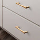 Gold Arched Cabinet Handles and Round Knobs
