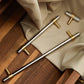 Two-Tone Round Bar Cabinet Handles with Brass Feet