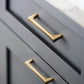 Gold Arched Cabinet Handles and Round Knobs