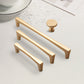 Gold Arched Cabinet Handles and Round Knobs