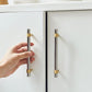 Two-Tone Round Bar Cabinet Handles with Brass Feet