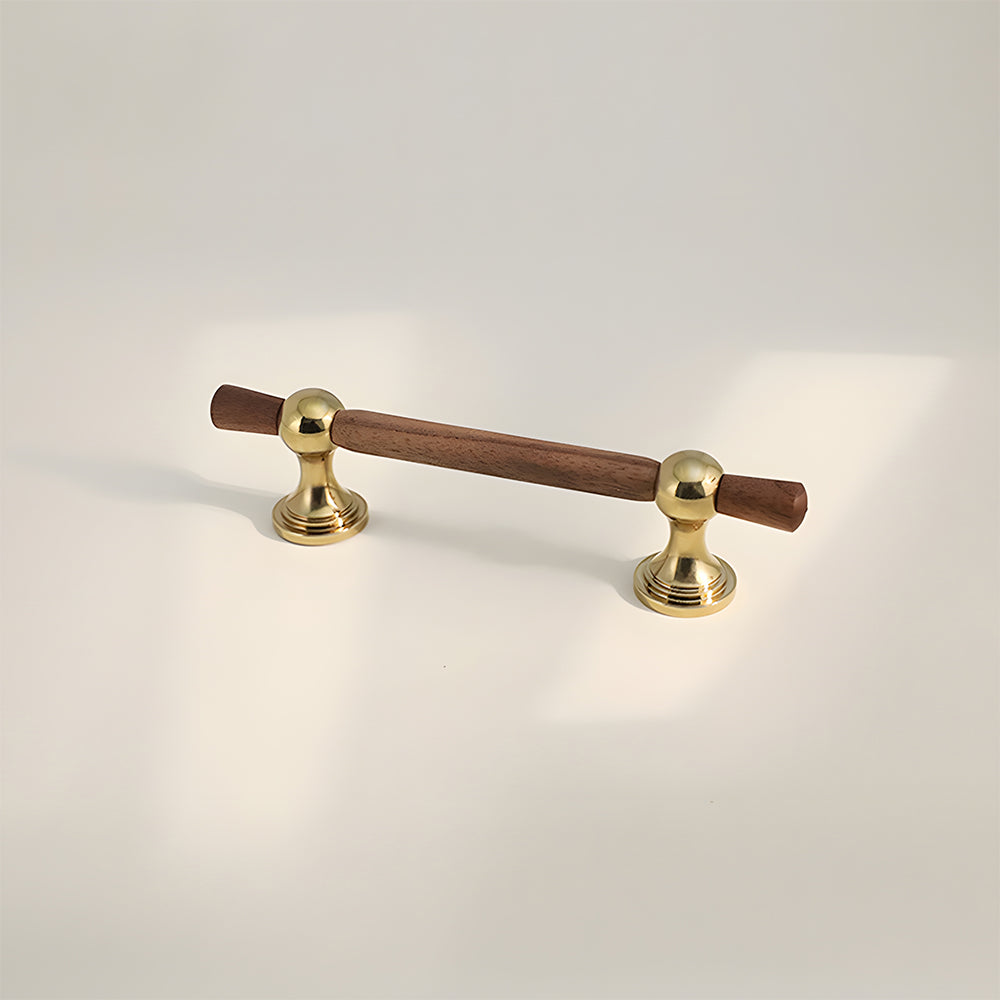 Wood T-bar cabinet pull with round metal pedestal mounts, presented for reference on a clean neutral background