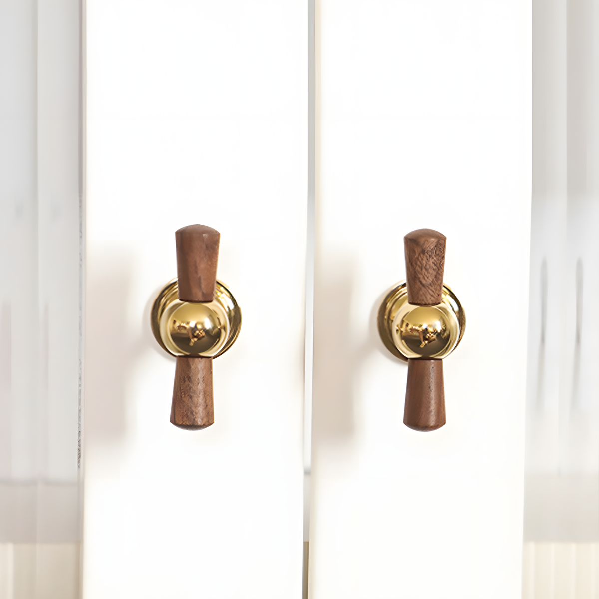 Wood T-bar cabinet pull with round metal pedestal mounts, pictured in one view installed on cabinetry in context