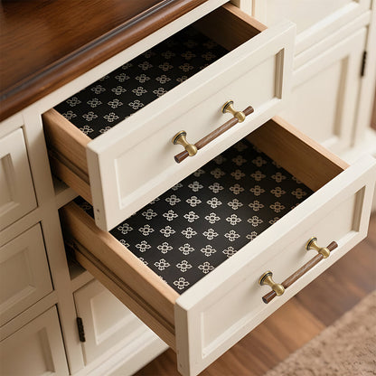 Wood T-bar cabinet pull with round metal pedestal mounts, shown at close range installed on cabinetry in context