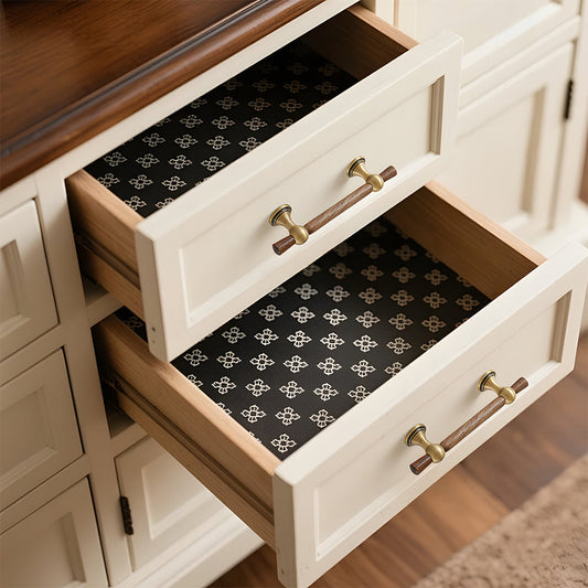 Wood T-bar cabinet pull with round metal pedestal mounts, shown at close range installed on cabinetry in context