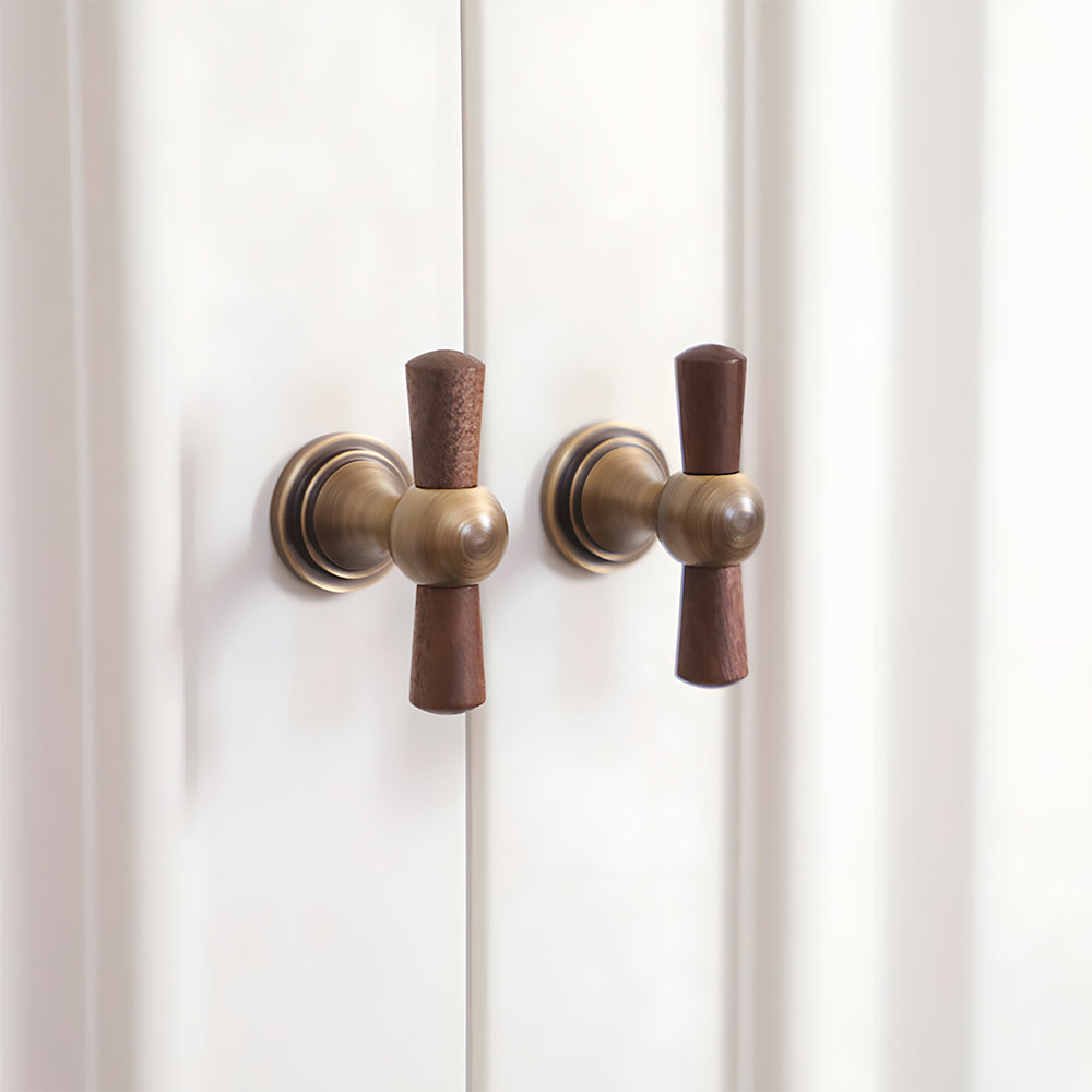 Wood T-bar cabinet pull with round metal pedestal mounts, presented in another view installed on cabinetry in context