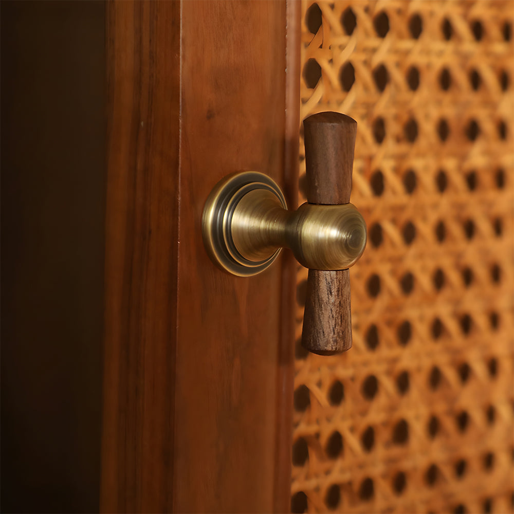 Wood T-bar cabinet pull with round metal pedestal mounts, shown from one angle mounted on a finished cabinet front