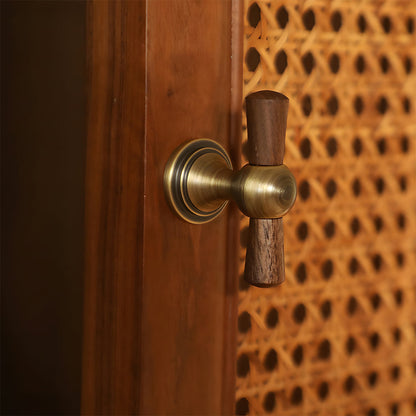 Wood T-bar cabinet pull with round metal pedestal mounts, shown from one angle mounted on a finished cabinet front