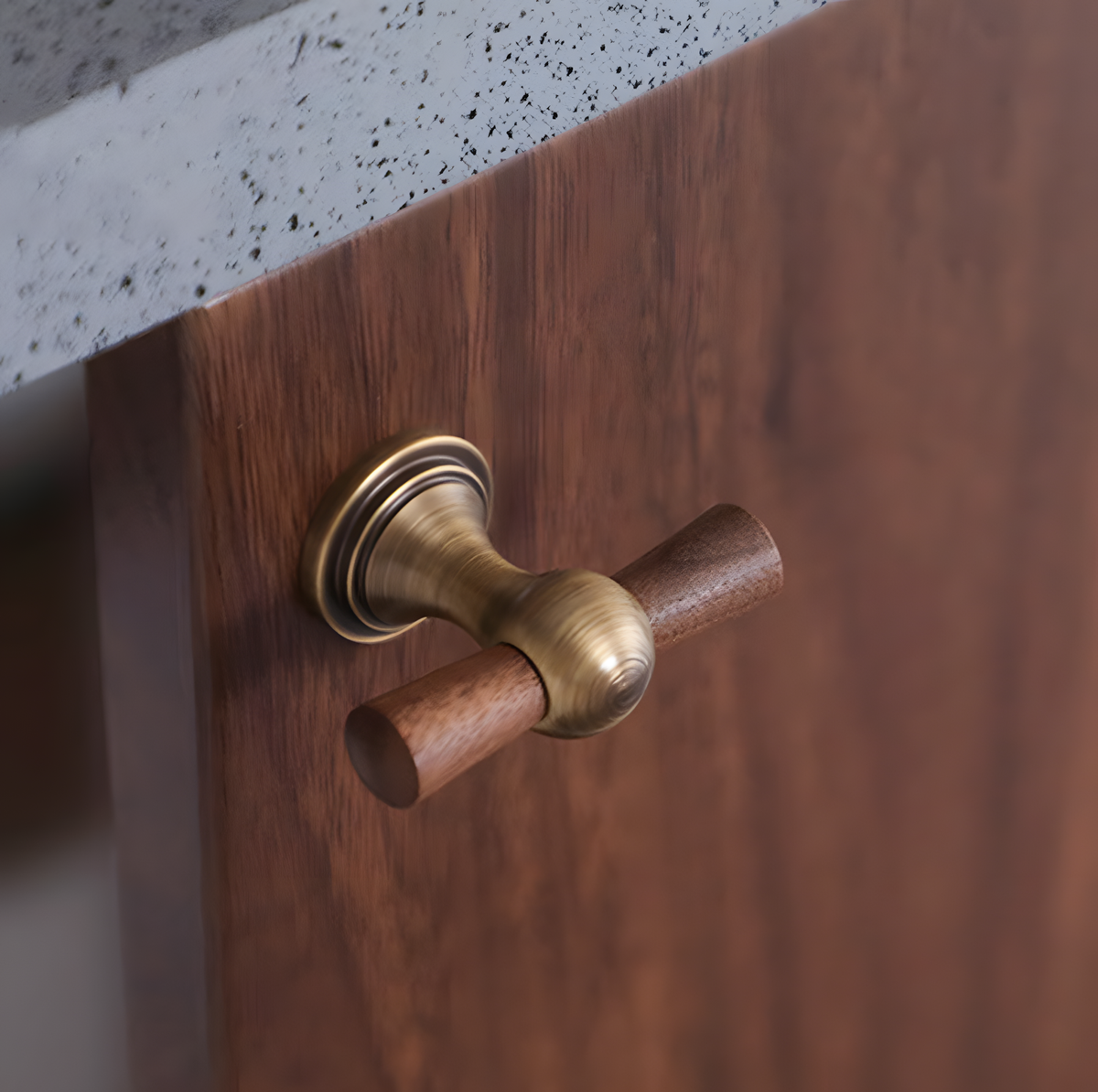 Wood T-bar cabinet pull with round metal pedestal mounts, pictured in one view in an installed cabinet close-up