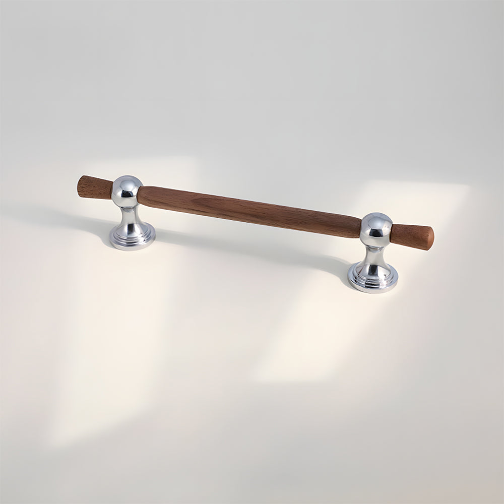 Wood T-bar cabinet pull with round metal pedestal mounts, displayed from the side on a clean neutral background