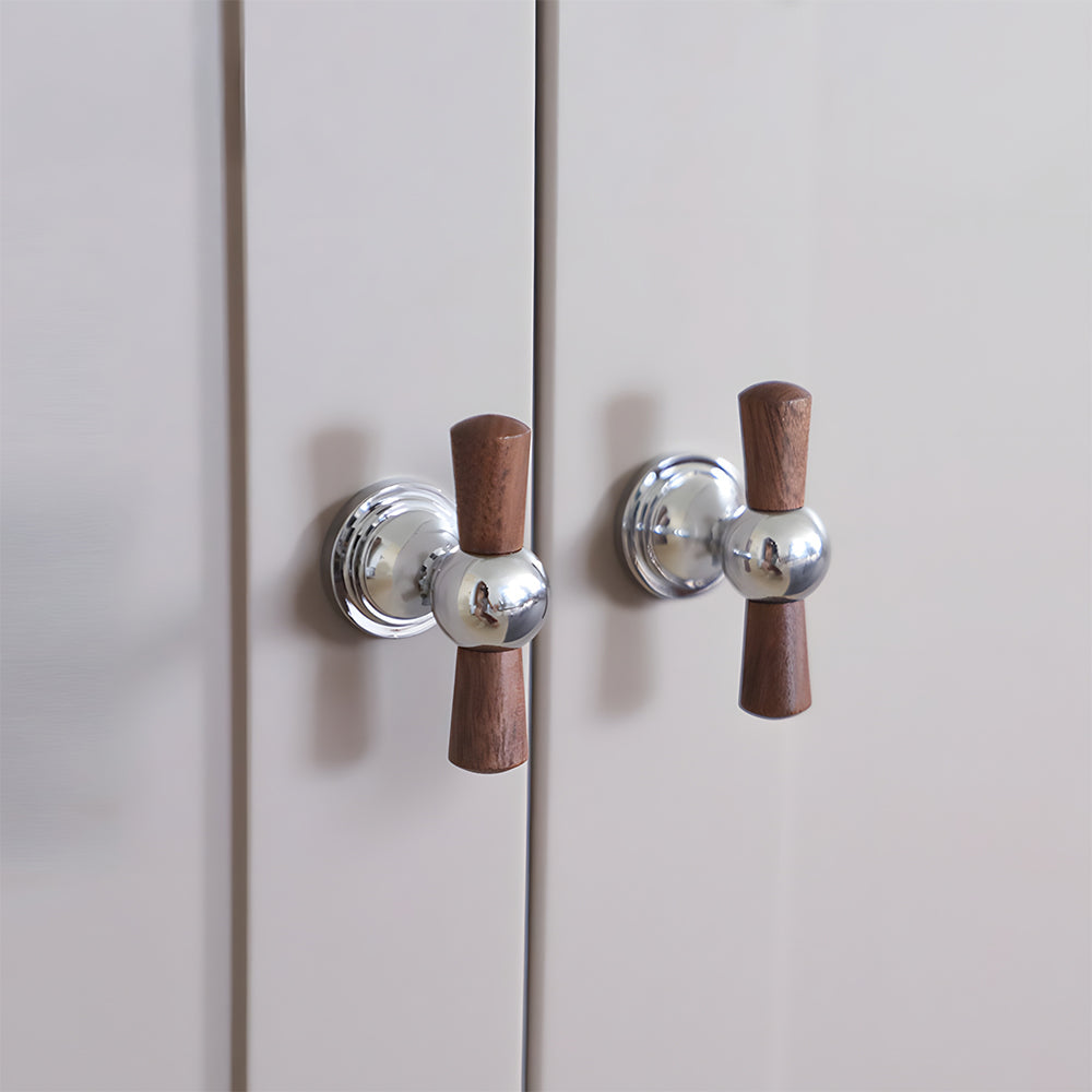 Wood T-bar cabinet pull with round metal pedestal mounts, presented for reference mounted on a finished cabinet front