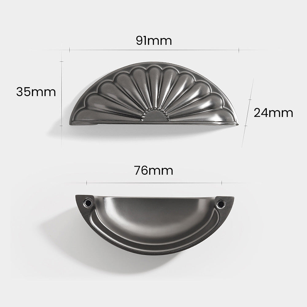 Shell-shaped cabinet cup pull, shown clearly with dimensions and centers labeled