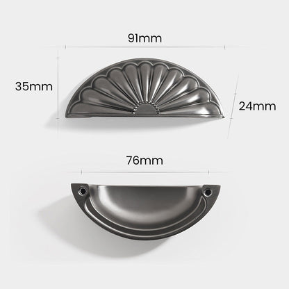 Shell-shaped cabinet cup pull, shown clearly with dimensions and centers labeled