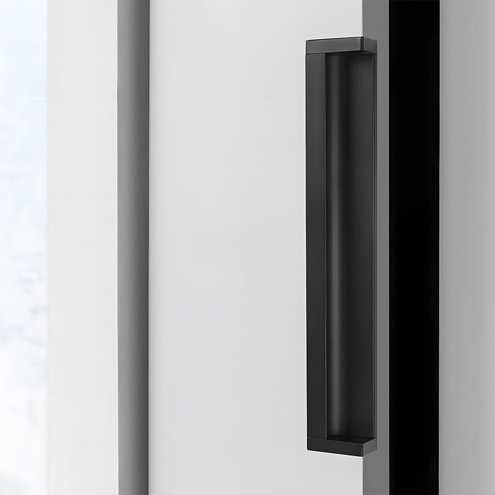 Black recessed aluminum finger edge pull, presented for reference in an installed cabinet close-up