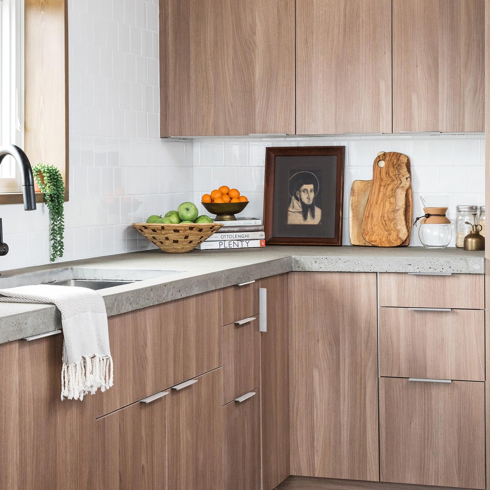 Square aluminum cabinet edge pull, presented in another view installed on cabinetry in context