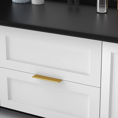 Brushed brass square aluminum cabinet edge pull, presented in another view mounted on a finished cabinet front