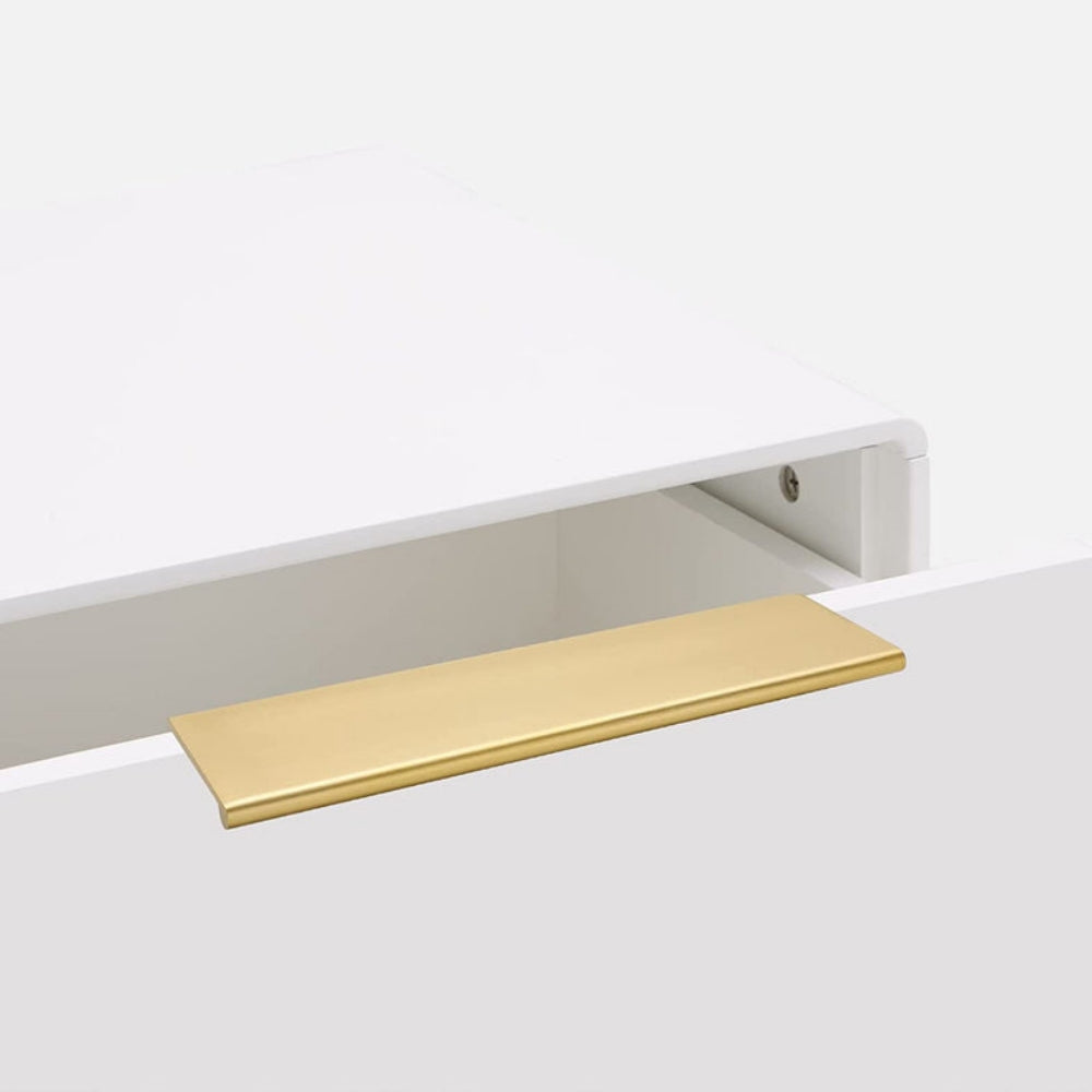 Brushed brass square aluminum cabinet edge pull, displayed from the side in an installed cabinet close-up