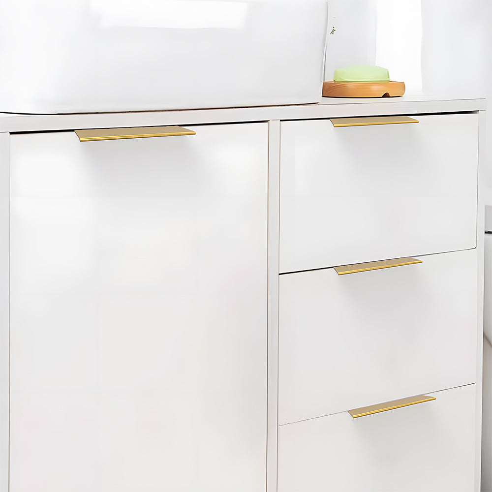 Brushed brass square aluminum cabinet edge pull, shown clearly with its installed position visible