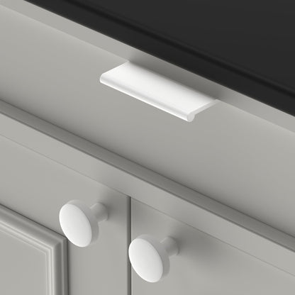 White square aluminum cabinet edge pull, shown clearly with the finish and grip area visible