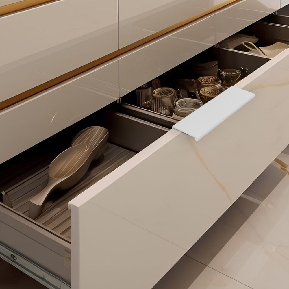 White square aluminum cabinet edge pull, shown in a focused view with its installed position visible
