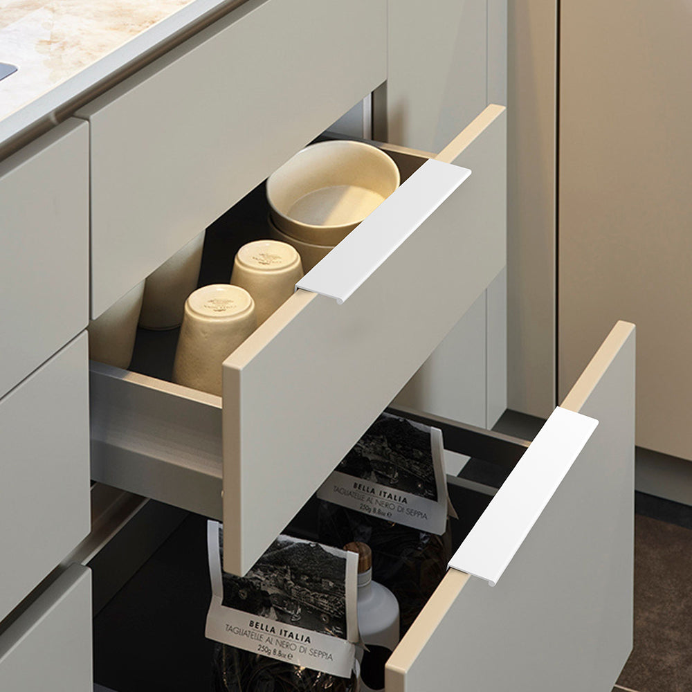 White square aluminum cabinet edge pull, shown clearly against the cabinet surface for scale