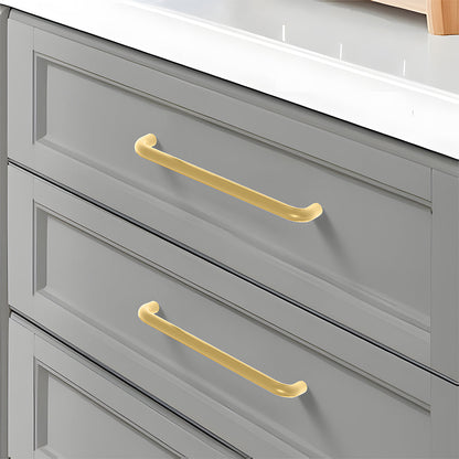 Gold rounded aluminum cabinet pull, pictured in one view installed on cabinetry in context