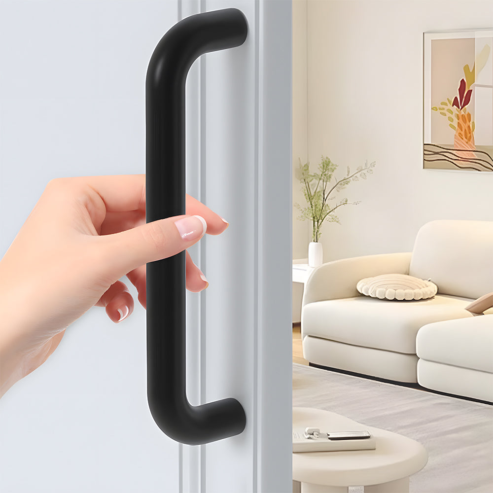Rounded aluminum cabinet pull, shown clearly while held or operated by hand with key hardware details visible