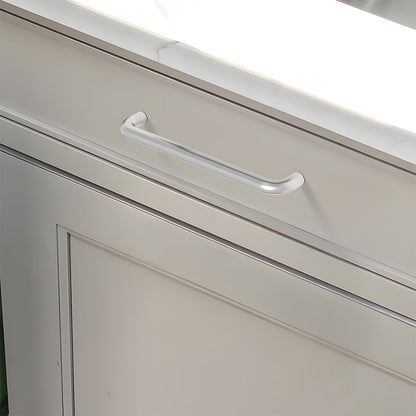 Silver rounded aluminum cabinet pull, displayed from the side mounted on a finished cabinet front