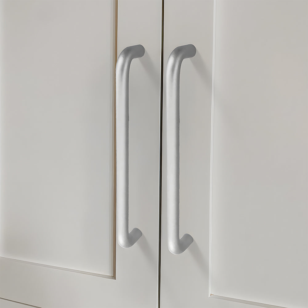 Silver rounded aluminum cabinet pull, shown in a focused view mounted on a finished cabinet front