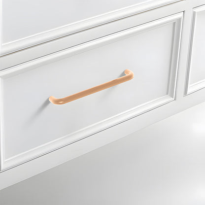 Champagne bronze rounded aluminum cabinet pull, shown from one angle with its installed position visible