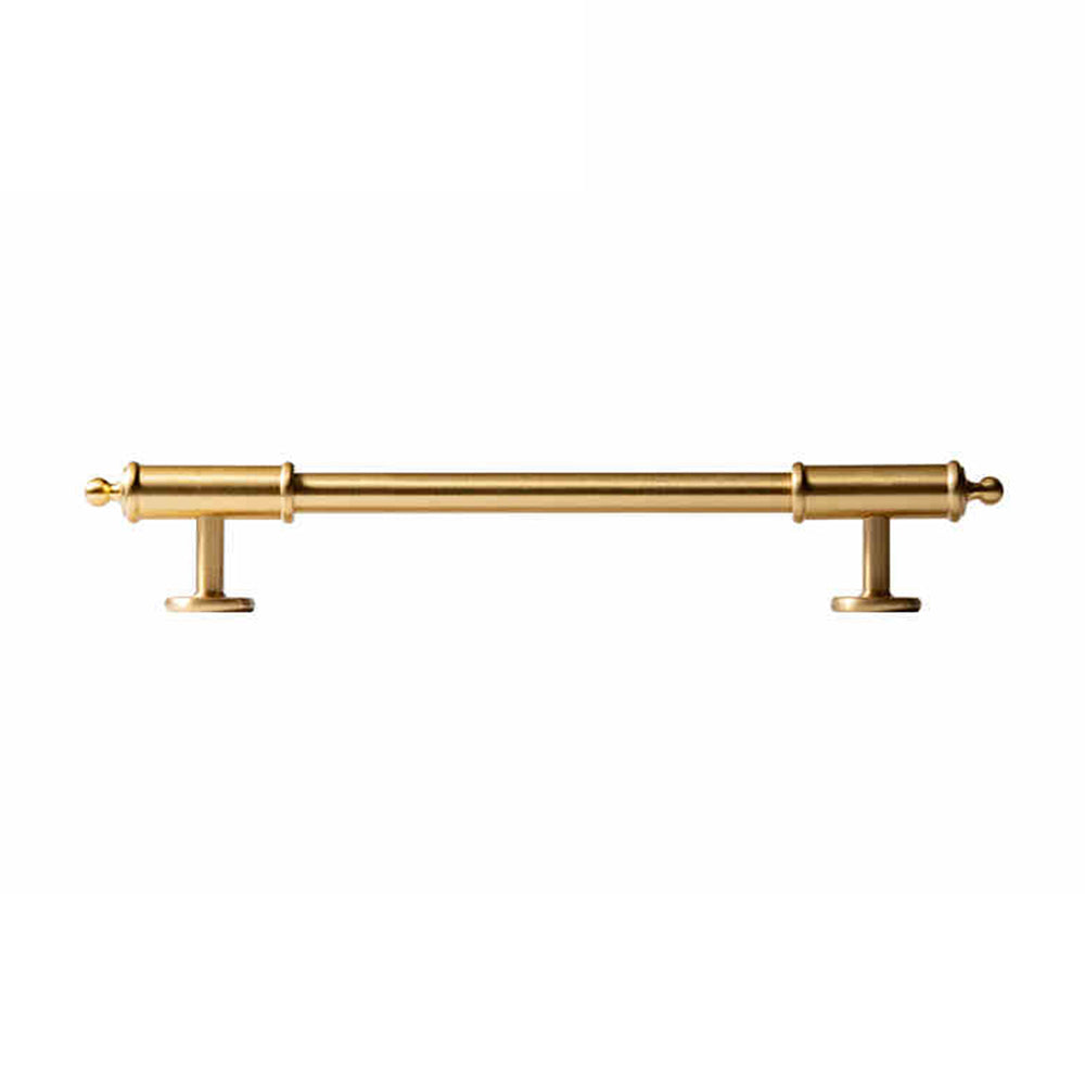 Antique brass round bar cabinet pull with matching T-knob, shown at close range on a clean neutral background