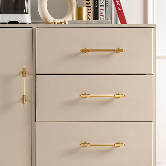 Antique brass round bar cabinet pull with matching T-knob, shown clearly installed on cabinetry in context