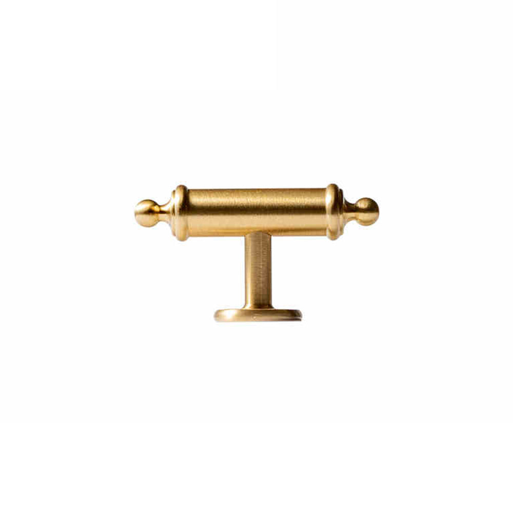 Antique brass round bar cabinet pull with matching T-knob, shown in a focused view on a clean neutral background