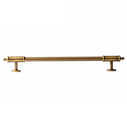 Antique brass round bar cabinet pull with matching T-knob, shown from one angle with its shape and finish visible
