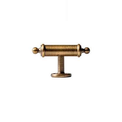 Antique brass round bar cabinet pull with matching T-knob, presented for reference with its shape and finish visible