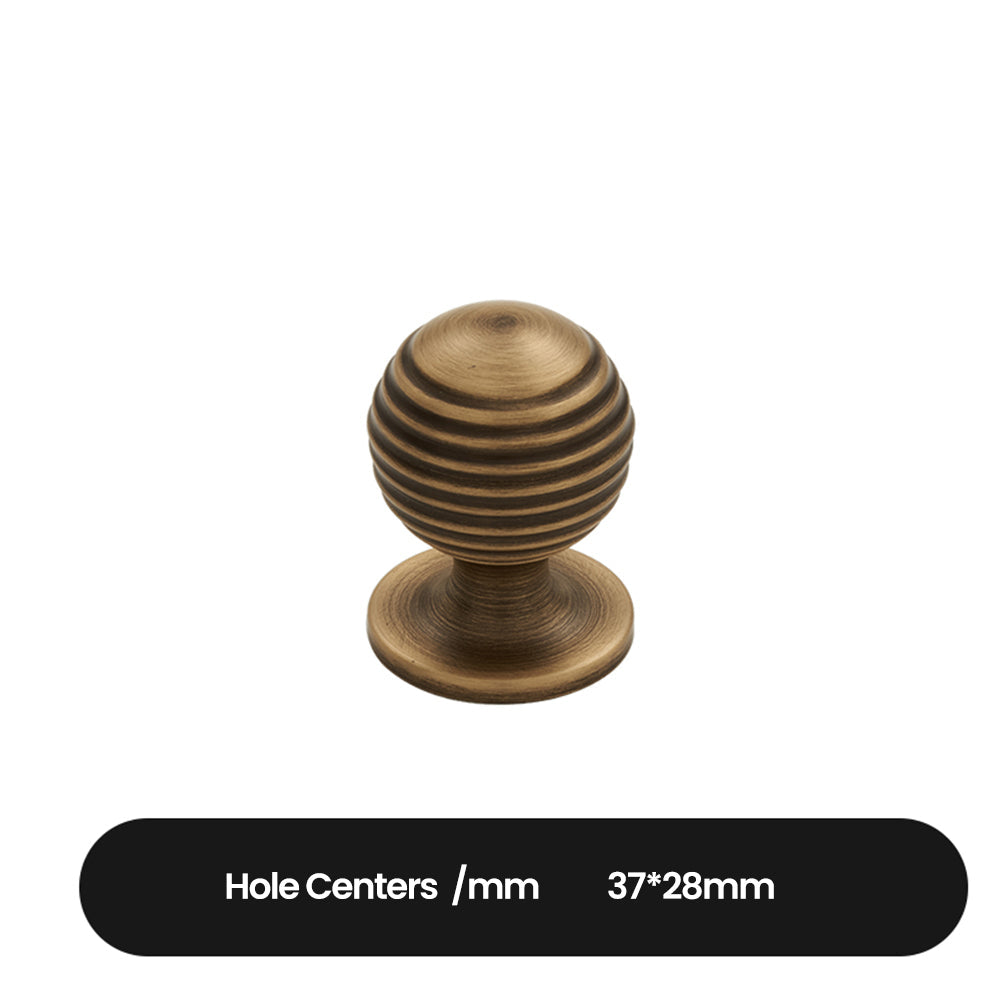 Antique bronze cabinet pull with matching ribbed knob, shown from one angle with dimensions and centers labeled