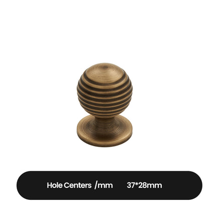 Antique bronze cabinet pull with matching ribbed knob, shown from one angle with dimensions and centers labeled