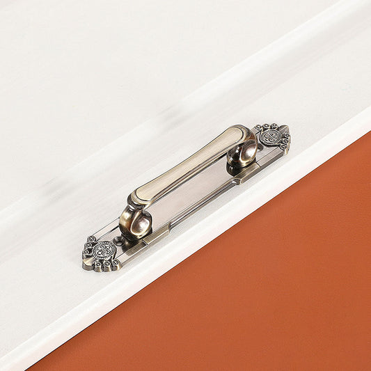 Antique bronze cabinet pull with decorative floral backplate, pictured in one view on a clean neutral background