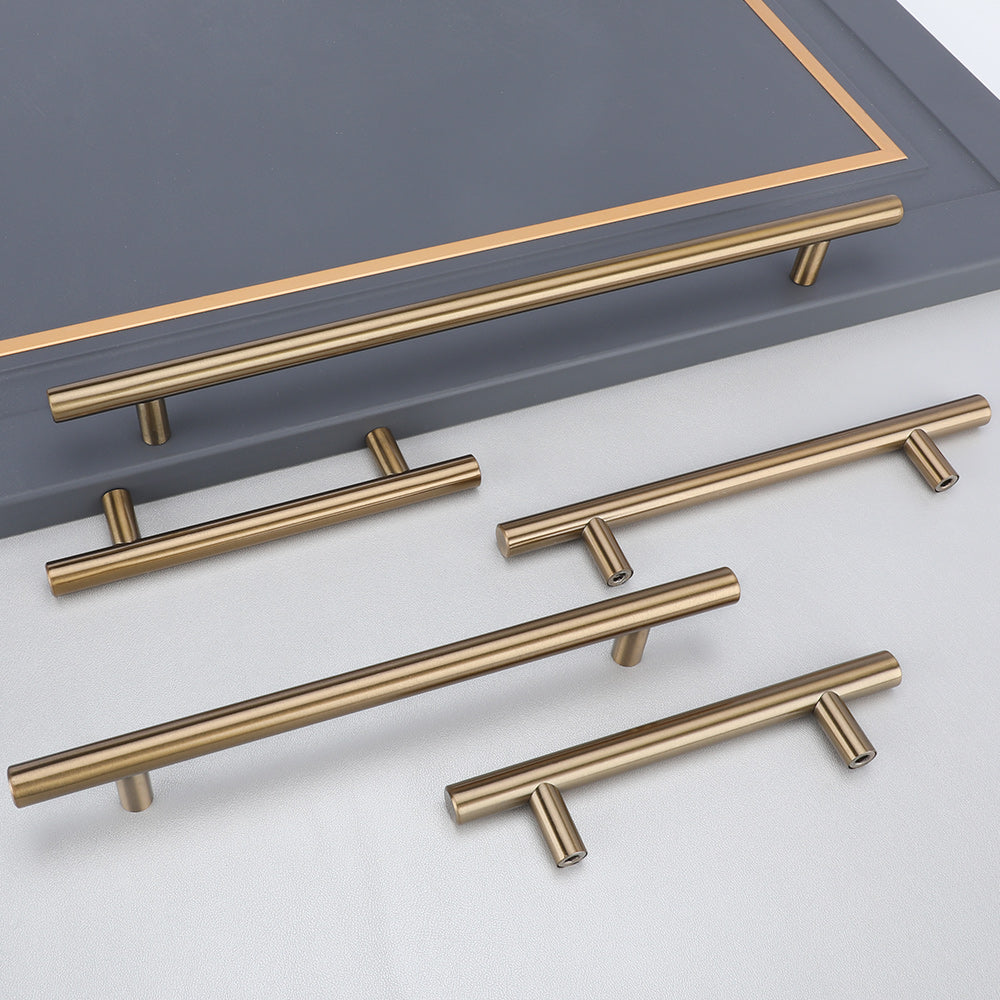 Round T-bar antique bronze cabinet pull, shown clearly with related hardware in one display