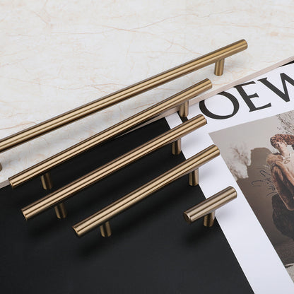 Round T-bar antique bronze cabinet pull, shown from one angle with related hardware in one display