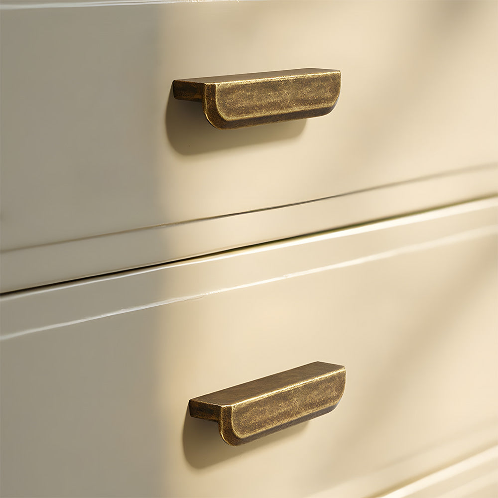 Antique bronze recessed cabinet pull, pictured in one view installed on cabinetry in context