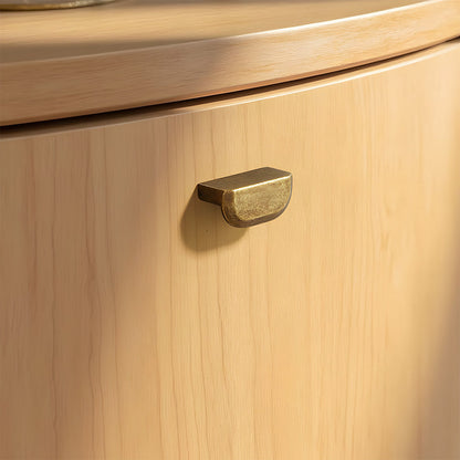 Antique bronze recessed cabinet pull, shown clearly in an installed cabinet close-up