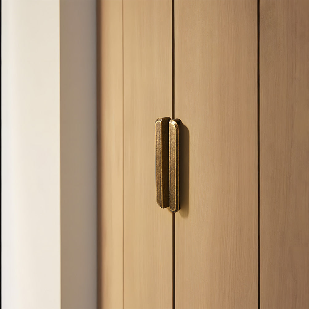 Antique bronze recessed cabinet pull, pictured in one view in an installed cabinet close-up