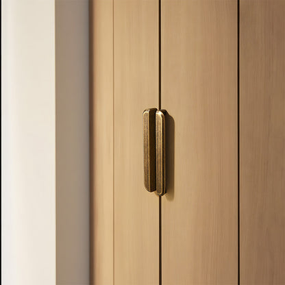 Antique bronze recessed cabinet pull, pictured in one view in an installed cabinet close-up