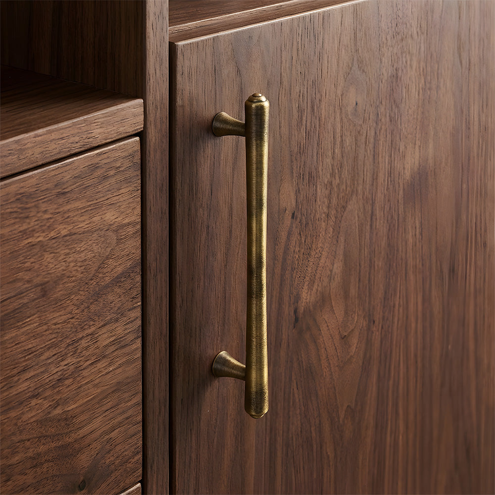 Antique bronze round bar cabinet pull, shown clearly in an installed cabinet close-up