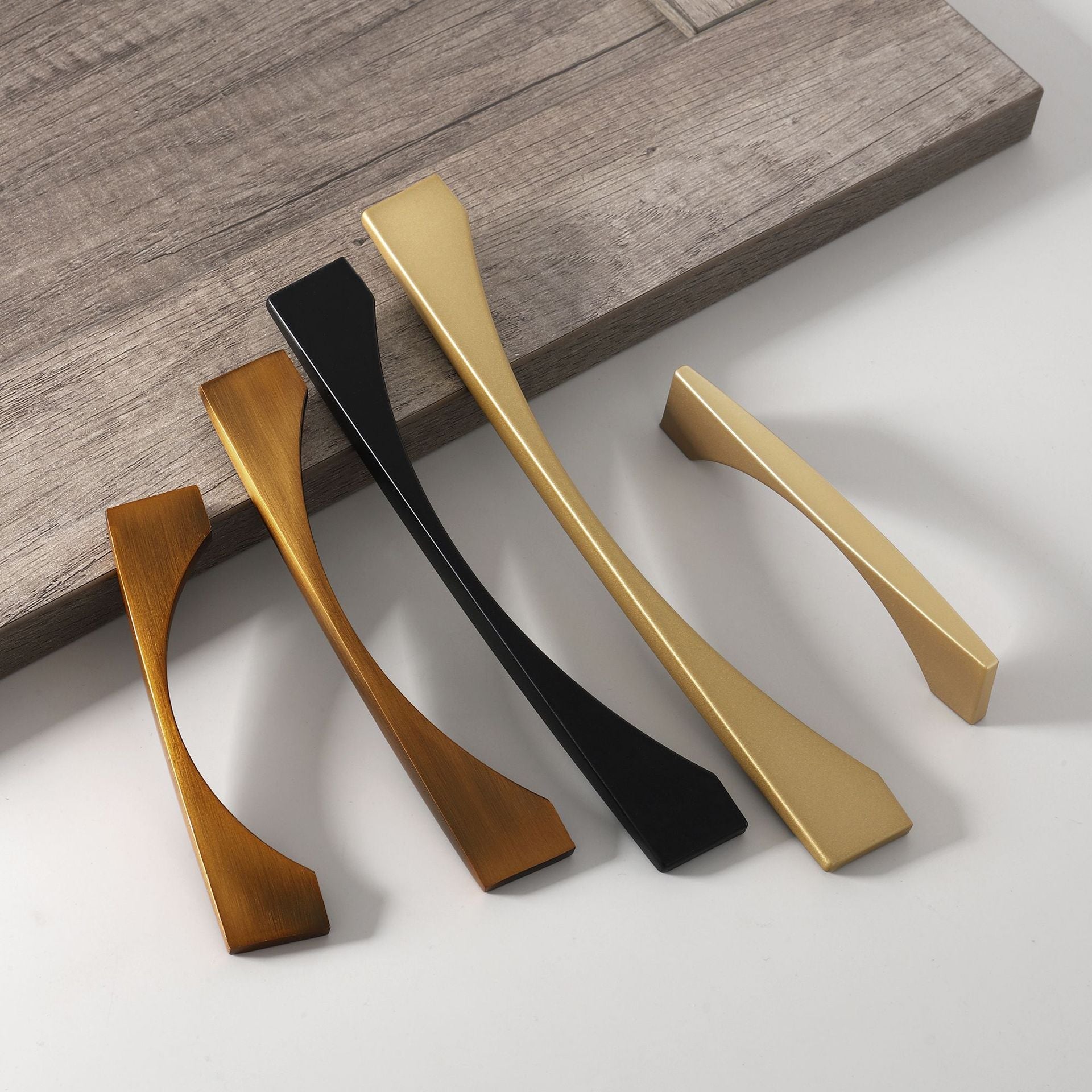 Arched aluminum cabinet pull, shown from one angle as a color and finish lineup with key hardware details visible